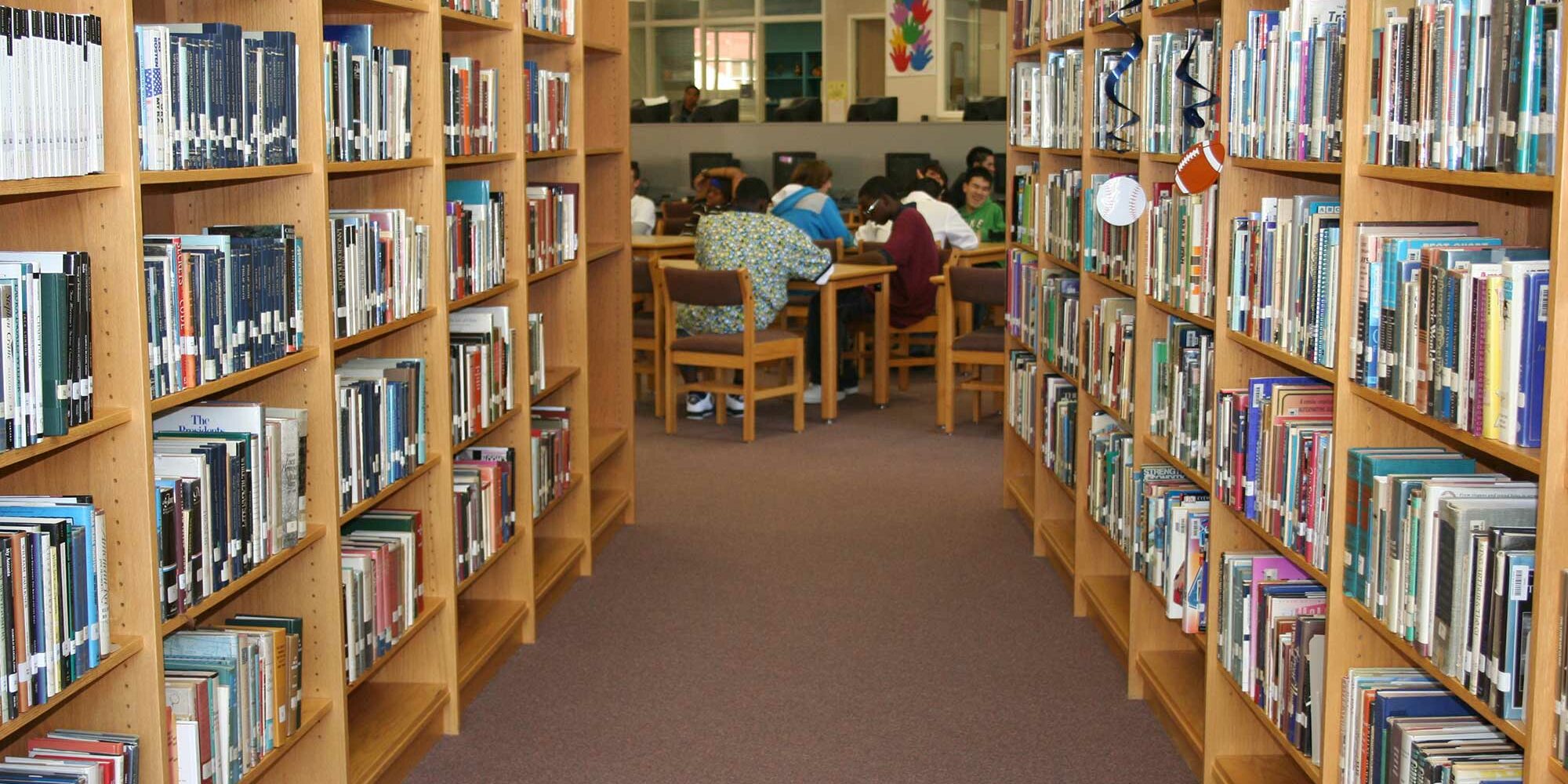 Bookshelves with kids reading